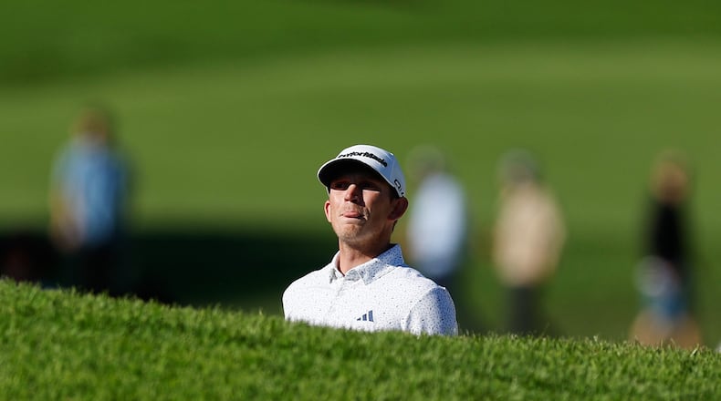 Jacob Bridgeman prepares to hit from a bunker on the 14th hole during the third round of the Genesis Invitational golf tournament at Riviera Country Club, Saturday, Feb. 21, 2026, in the Pacific Palisades area of Los Angeles. (AP Photo/Caroline Brehman )