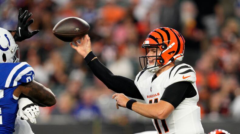 Cincinnati Bengals quarterback Logan Woodside (11) throws a pass during the first half of a preseason NFL football game against the Indianapolis Colts, Thursday, Aug. 22, 2024, in Cincinnati. (AP Photo/Jeff Dean)