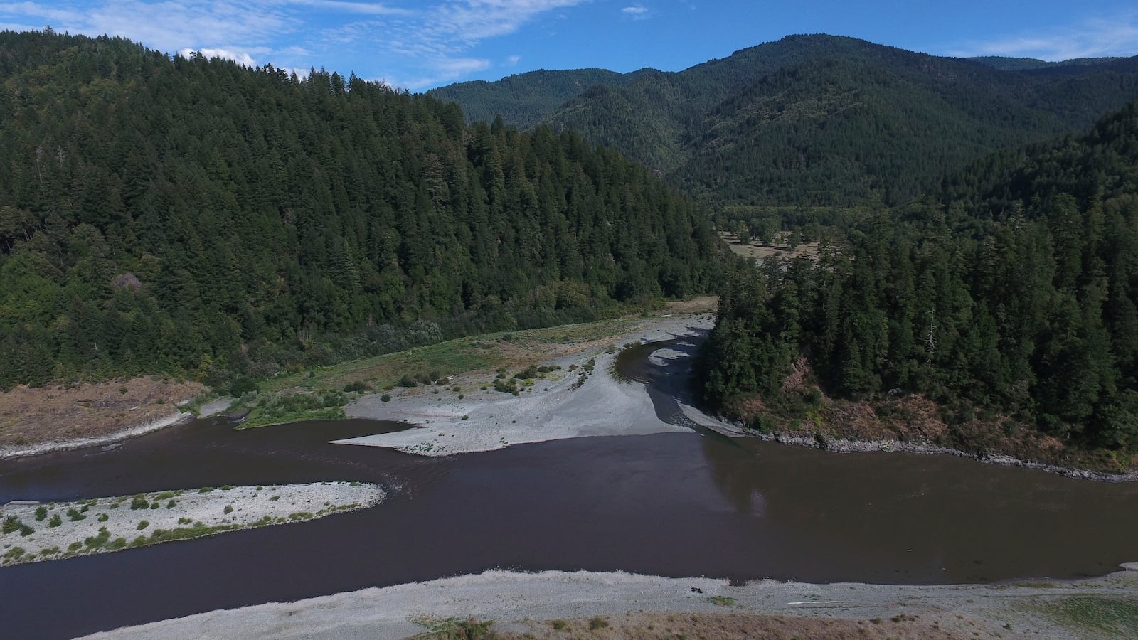 Blue Creek, center, flows into the Klamath River, Thursday, Sept. 19, 2024, in Humboldt County, Calif. (AP Photo/Godofredo A. Vásquez)