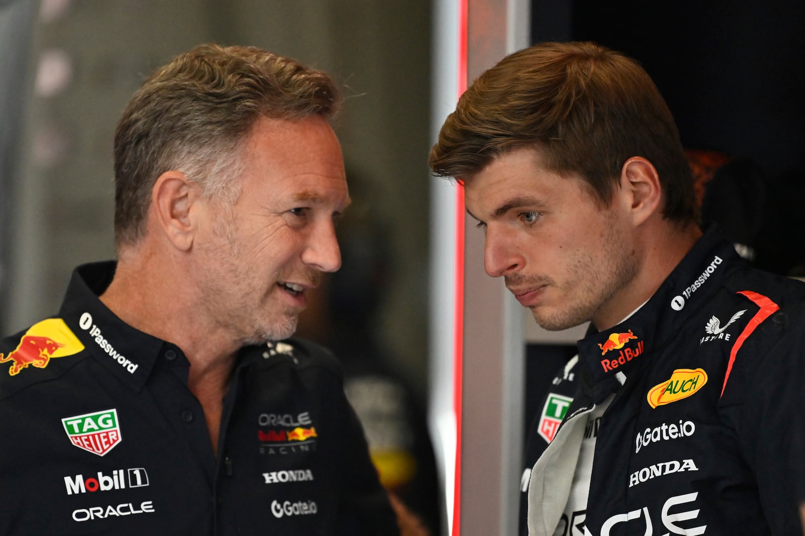 FILE -Red Bull team principal Christian Horner talkks to Red Bull driver Max Verstappen of the Netherlands before the third free practice at the Red Bull Ring racetrack, ahead of the Austrian Formula One Grand Prix in Spielberg, Austria, Saturday, June 28, 2025. (AP Photo/Denes Erdos), File)