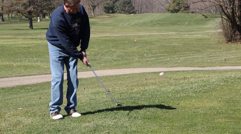 Dave Bernas tees off on the North course at Reid Park Wednesday morning. BILL LACKEY/STAFF