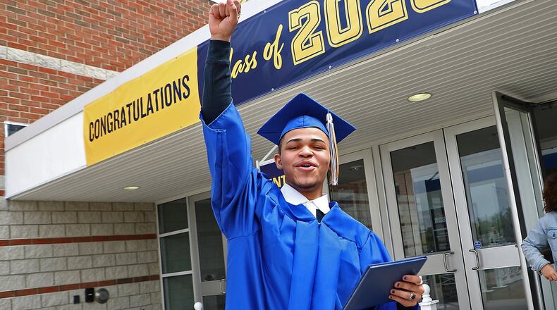 Delvin Bishop celebrates outside Springfield High School in July after receiving his diploma in an individual ceremony in the school’s gymnasium. BILL LACKEY/STAFF