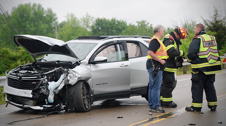 Crews work at a multi-vehicle accident near the intersection of Dayton-Springfield Road and S. Tecumseh Road near Interstate 70 on Tuesday, May 14, 2024. MARSHALL GORBY \STAFF
