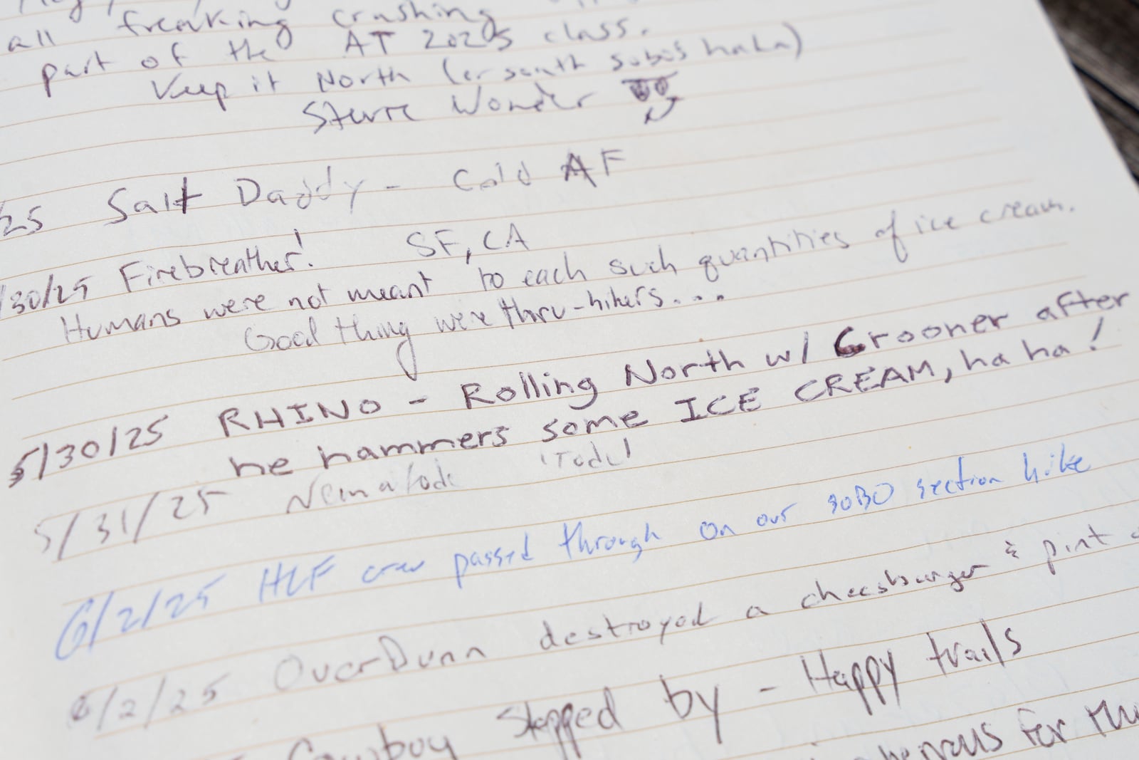 Entries in a hiker logbook at Pine Grove Furnace State Park in Pennsylvania on Tuesday, June 10, 2025. (AP Photo/Mingson Lau)