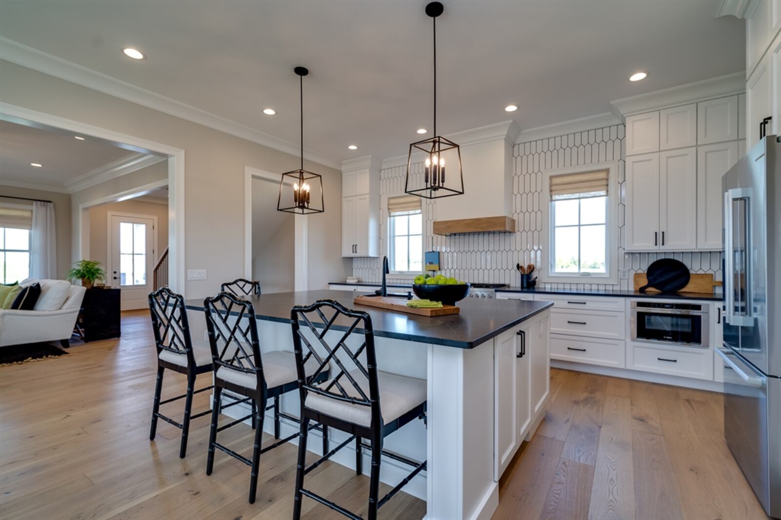 In the kitchen, a 7-foot island offers seating for up to eight along the extended granite counter. CONTRIBUTED PHOTO 