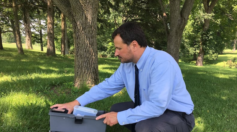 Larry Shaffer, environmental director at the Clark County Combined Health District, inspects a mosquito trap in 2017. The district’s traps have detected mosquitoes with West Nile Virus. Katherine Collins/Staff