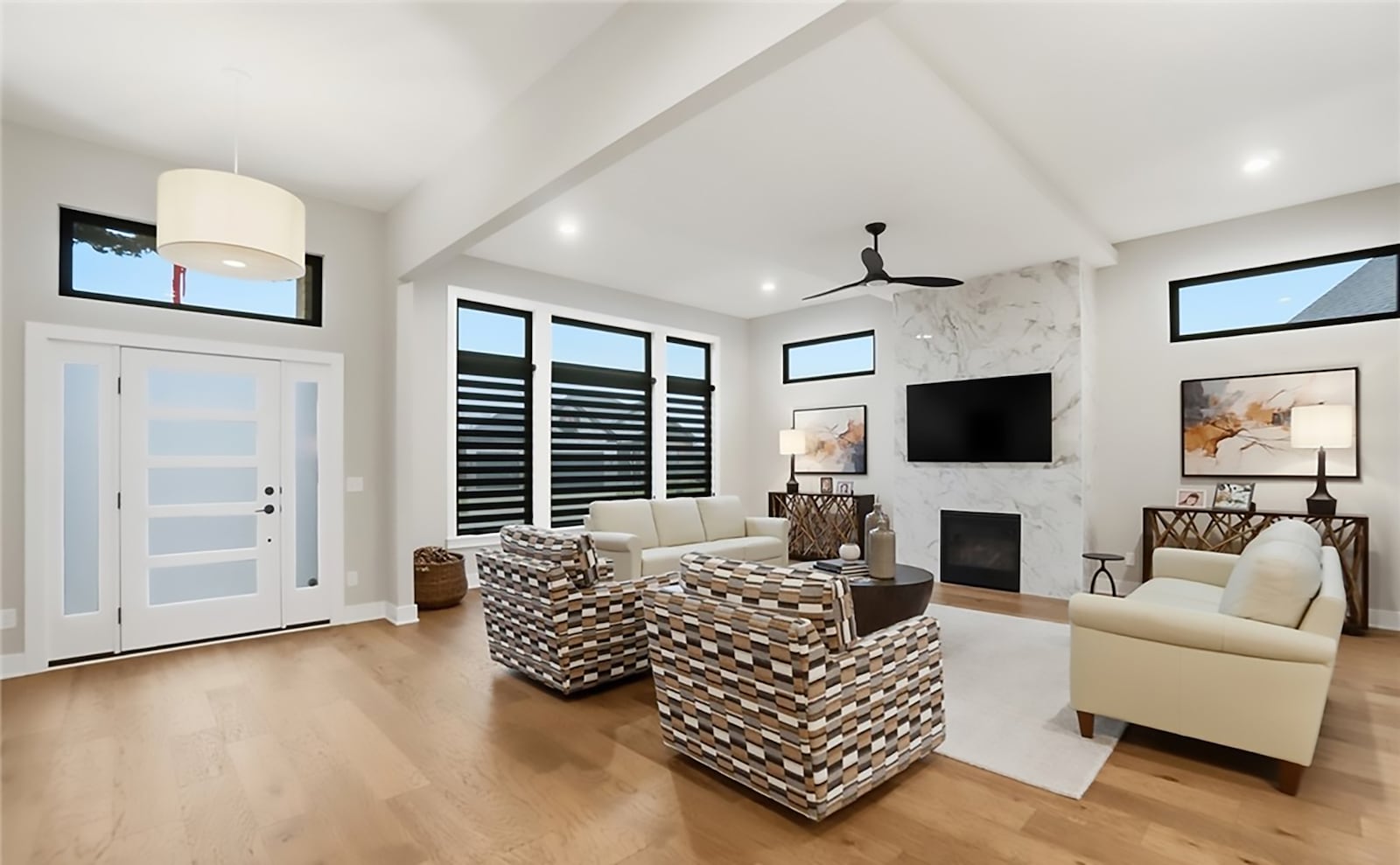 the family room has hardwood floors, a ceiling fan and recessed lighting. There is also a floor to ceiling gas fireplace. CONTRIBUTED