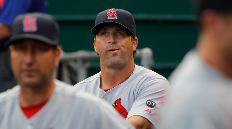 Cardinals manager Mike Matheny looks up at the scoreboard before a game against the Reds on Tuesday, Aug. 4, 2015, at Great American Ball Park in Cincinnati. David Jablonski/Staff
