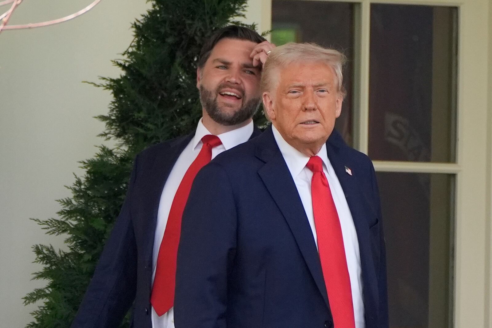 FILE - President Donald Trump and Vice President JD Vance pause near the Oval Office after and event to welcome the 2025 College Football National Champions, the Ohio State University football team on the South Lawn of the White House, April 14, 2025, in Washington. (AP Photo/Alex Brandon, File)