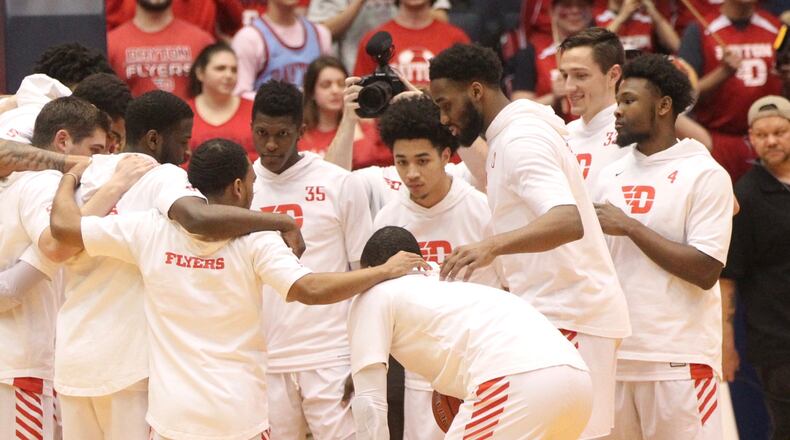 Dayton huddles before a game against Rhode Island on March 1, 2019, at UD Arena.