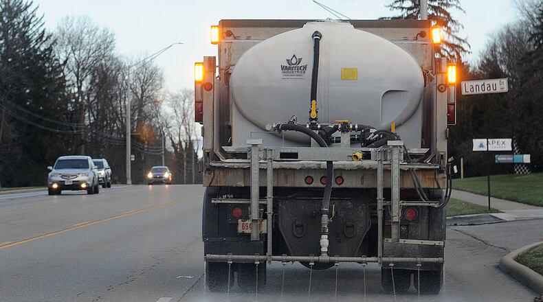 The city of Kettering prepared for upcoming snow on Wednesday, Jan. 5, 2022, by treating roads, including Far Hills Avenue, with deicer. MARSHALL GORBY\STAFF