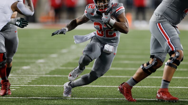 FILE - Ohio State running back TreVeyon Henderson plays against Michigan State during an NCAA college football game Saturday, Nov. 11, 2023, in Columbus, Ohio. TreVeyon Henderson said Wednesday, Dec. 27, 2023 that he would play when Buckeyes (11-1) play Missouri (10-2) in the Cotton Bowl.(AP Photo/Jay LaPrete, File)