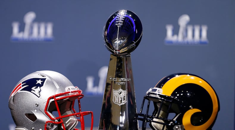 ATLANTA, GA - JANUARY 30: Detail of the Lombardi Trophy and the helmets of the New England Patriots (left) and the Los Angeles Rams prior to NFL Commissioner Roger Goodell speaking during a press conference during Super Bowl LIII Week at the NFL Media Center inside the Georgia World Congress Center on January 30, 2019 in Atlanta, Georgia. (Photo by Mike Zarrilli/Getty Images)