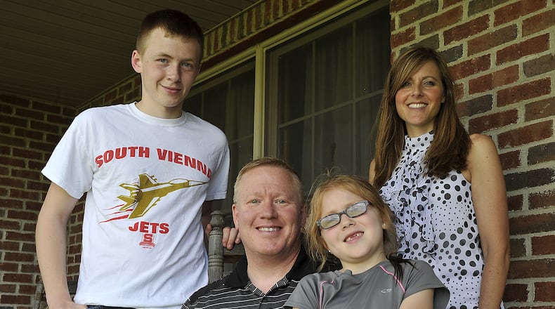 Desert Storm and Iraq War veteran Kevin Smith is shown with his wife, Christine, and their children, Justin, 15, and Jaidin, 7 in this file photo. Smith received the maximum bonus of $1,500 for his service. Clark and Champaign county veterans have received close to $1 million in tax-exempt bonus money from the state for their service in Desert Storm, Iraq and Afghanistan. Bill Lackey/Staff
