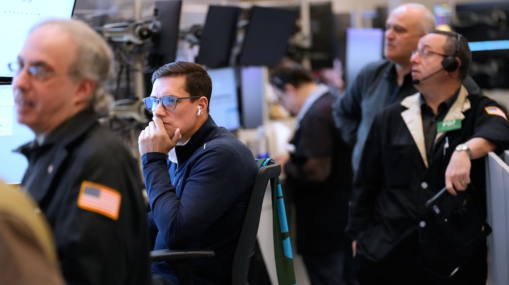 Traders work on the floor at the New York Stock Exchange in New York, Monday, March 2, 2026. (AP Photo/Seth Wenig)