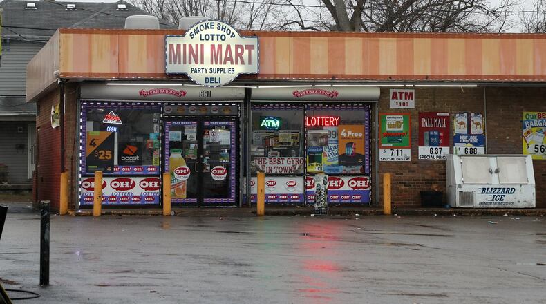 Springfield police are investigating a shooting and stabbing that was reported at the Mini-Mart, 961 Selma Road. BILL LACKEY/STAFF