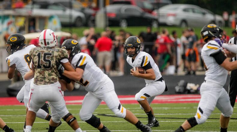 Centerville quarterback Chase Harrison carries the ball during their season opener football game against Fairfield Friday, August 30 in Fairfield. Farifield won 33-7. NICK GRAHAM/STAFF
