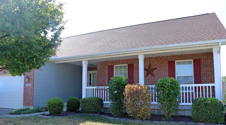 Listed for $379,900 by eXp Realty, the brick ranch at 4670 Santa Anita Place in Huber Heights has about 1,508 square feet of living space upon a full basement. A covered porch stretches across the front formal entry and a concrete driveway leads up to the two-car garage. A wooden privacy fence surrounds the spacious back yard with a tree island sitting area and storage barn. CONTRIBUTED