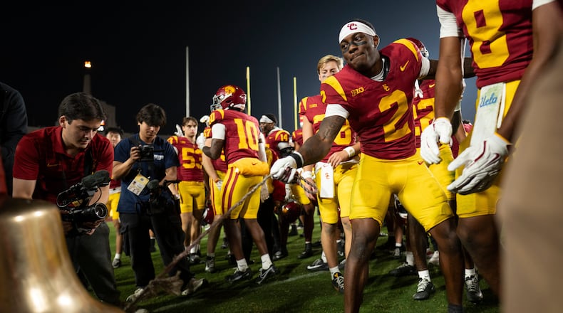 Southern California defensive back DJ Harvey (2) rings the Victory Bell after an NCAA college football game against UCLA Saturday, Nov. 29, 2025, in Los Angeles. (AP Photo/Kyusung Gong)