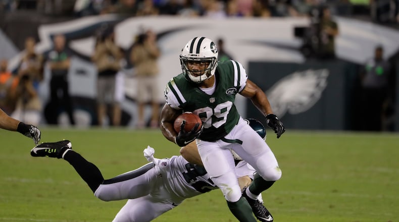 Jalin Marshall, of the New York Jets, runs with the ball against the Eagles’ Chris Maragos during the first half of a preseason game, Thursday, Sept. 1, 2016, in Philadelphia. (AP Photo/Matt Rourke)
