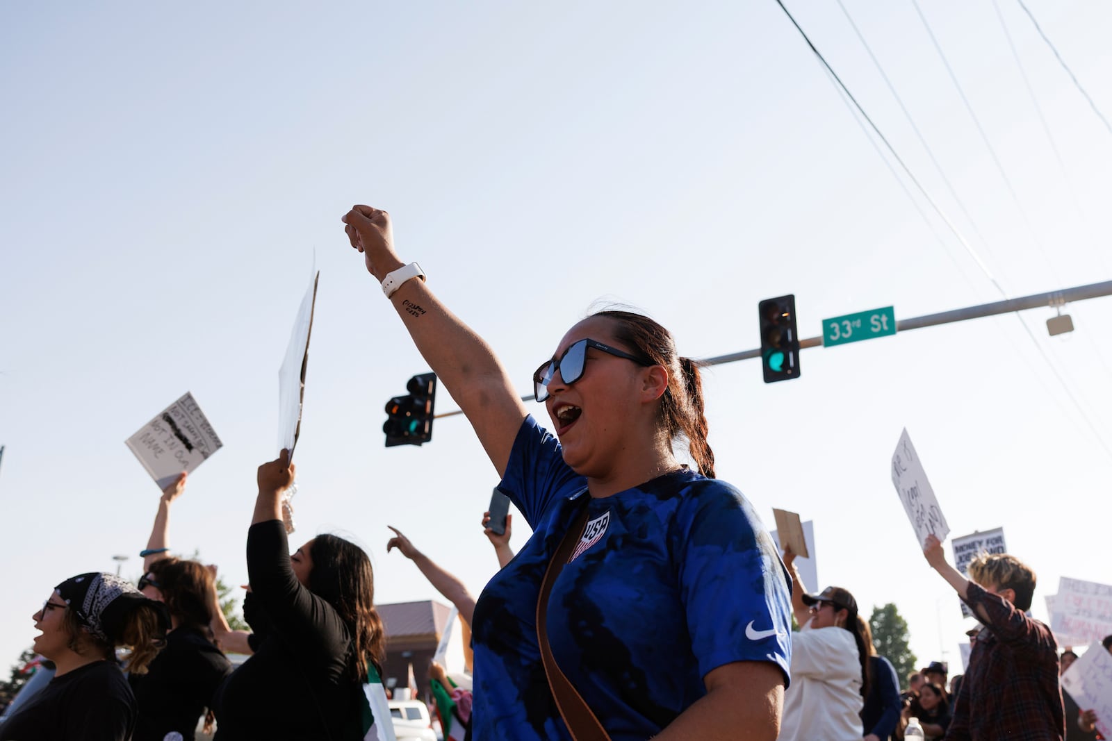 Hundreds gather in after U.S. Immigration and Customs Enforcement conducted a raid earlier in the day in Omaha, Neb. on Tuesday, June 10, 2025. (Nikos Frazier/Omaha World-Herald via AP)