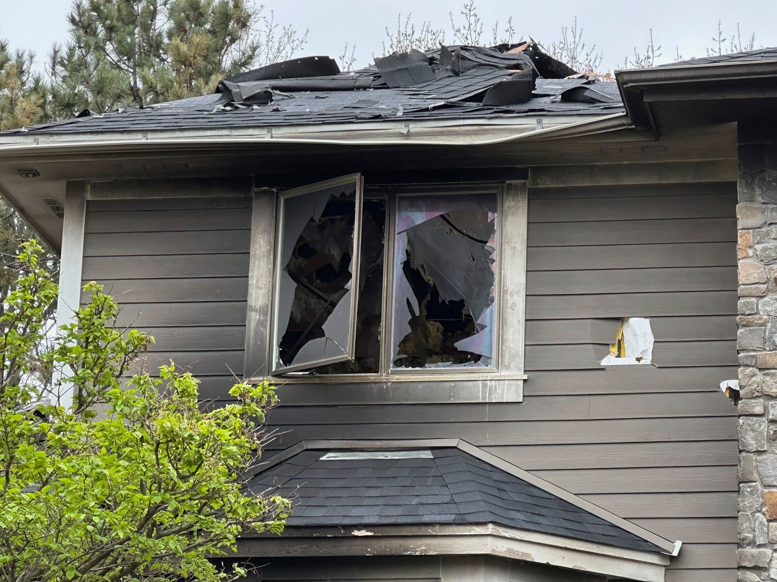 The home of Jill Sobule showed heavy damage on Friday, May 2, 2025, in Woodbury, Minn., a day after a fire engulfed the house, killing the 66-year-old singer-songwriter. (AP Photo/Amy Forliti)