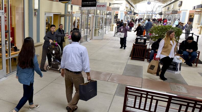 FILE: Shoppers look for Black Friday deals at Cincinnati Premium Outlets in Monroe. NICK GRAHAM/STAFF