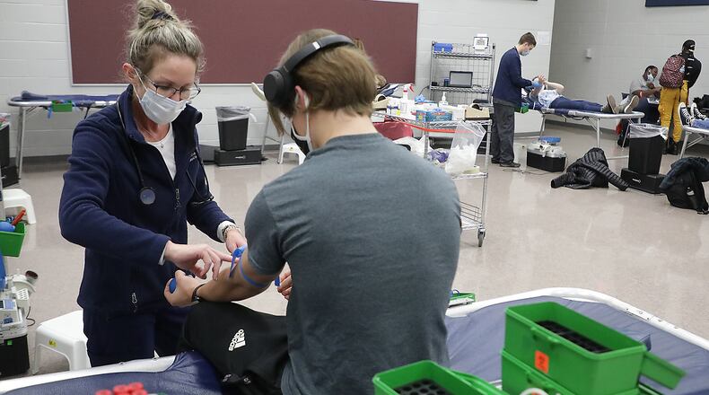 The Community Blood Center is facing a shortage. Here, students and staff at Springfield High School held a blood drive in January for the CBC to help get blood donors. BILL LACKEY/STAFF