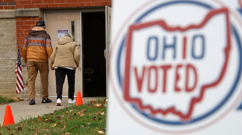 Voters walk into Tecumseh High School to cast their votes Tuesday, Nov. 7, 2023. BILL LACKEY/STAFF