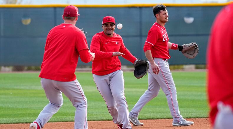 Cincinnati Reds shortstop Noelvi Marte, center, runs drills during an MLB spring training baseball practice, Friday, Feb. 17, 2023, in Goodyear, Ariz. (AP Photo/Matt York)