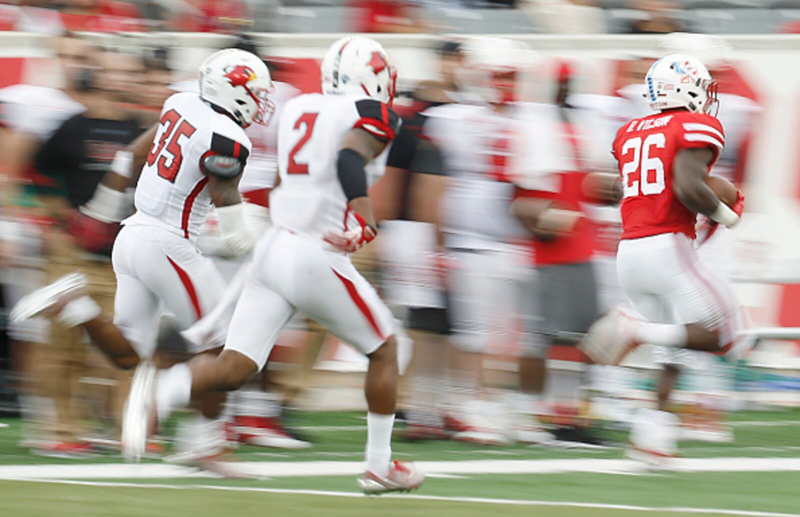 HOUSTON, TX - SEPTEMBER 10: Brandon Wilson #26 of the Houston Cougars returns a punt against the Lamar Cardinals in the second quarter at TDECU Stadium on September 10, 2016 in Houston, Texas. Houston won 42 to 0. (Photo by Thomas B. Shea/Getty Images)
