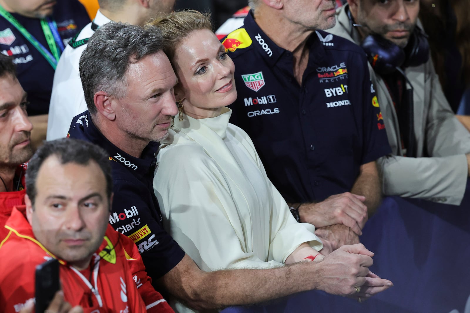 FILE -Red Bull team principal Christian Horner is flanked by his wife Geri Alliwell after the Formula One Saudi Arabian Grand Prix at the Jeddah Corniche Circuit, in Jedda, Saudi Arabia, March 9, 2024. (AP Photo/Giuseppe Cacace/Pool, File)