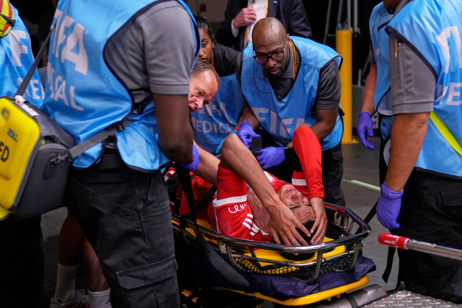 Bayern Munich's Jamal Musiala is taken off the field after an injury during the Club World Cup quarterfinal soccer match between PSG and Bayern Munich in Atlanta, Saturday, July 5, 2025. (AP Photo/Brynn Anderson)