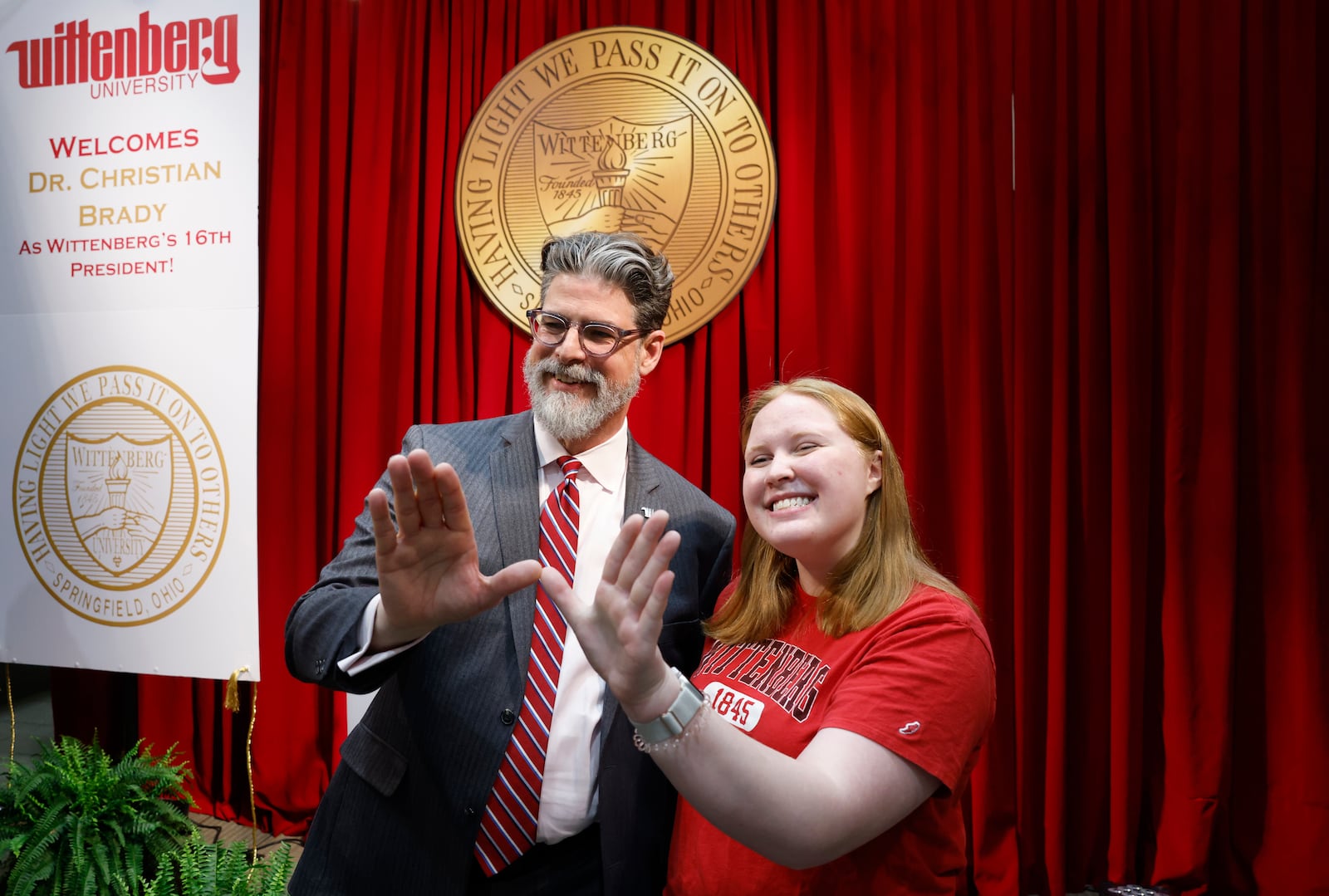 Dr. Christian M. M. Brady, left, takes a photo with Katie Lowry, a junior and student senate president, during an event where he was announced as the 16th president on Friday, May 9, 2025, at Wittenberg University. JOSEPH COOKE/STAFF