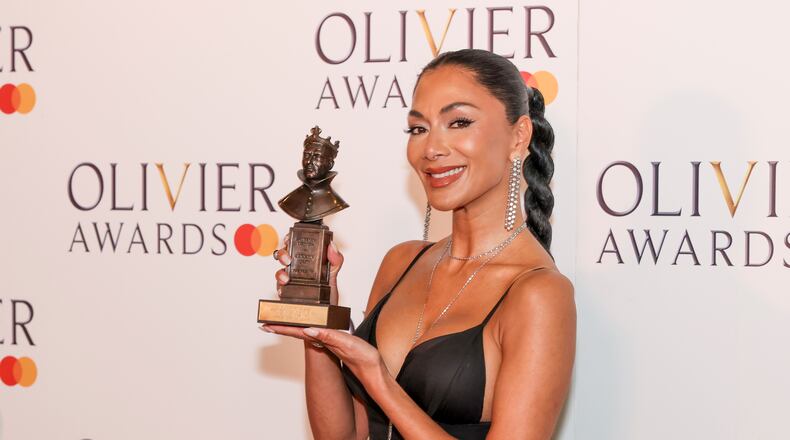 Nicole Scherzinger, winner of the best actress in a musical award for "Sunset Boulevard", poses for photographers in the winner's room during the Olivier Awards on Sunday, April 14, 2024, in London. (Photo by Vianney Le Caer/Invision/AP)
