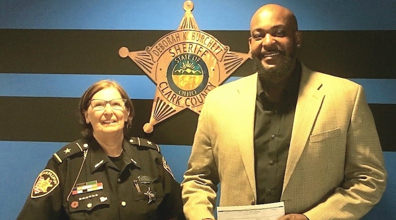 Clark County Sheriff Deb Burchett awarded nearly $20,000 in seized money to nonprofit organizations that focus on alcohol and drug prevention and education programs. Stephen Massey, at right, is the director of operations for CitiLookout in Springfield, which was one of seven grant recipients. CONTRIBUTED