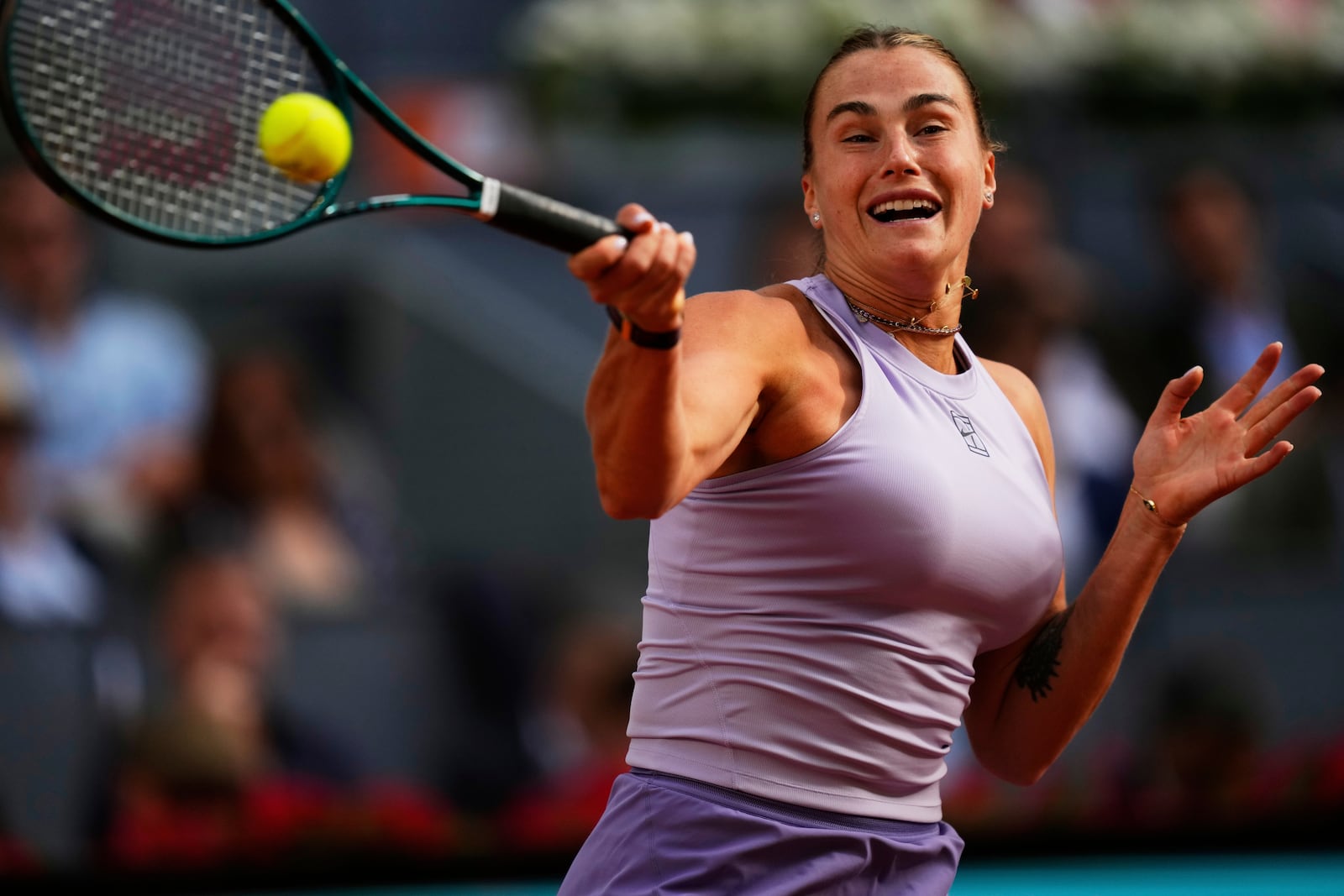 Aryna Sabalenka of Belarus returns to United States' Coco Gauff during the Madrid Open tennis final in Madrid, Spain, Saturday, May 3, 2025. (AP Photo/Jose Breton)