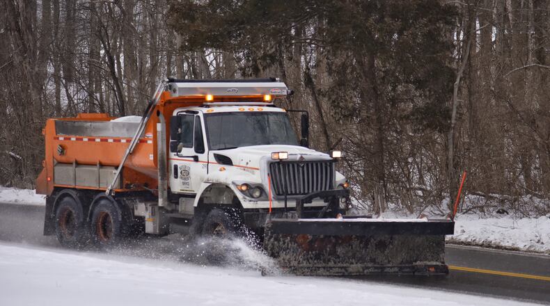 A Butler County Engineer's Office salt truck plows Elk Creek Road in Madison Twp. Monday, February 15, 2021. NICK GRAHAM/FILE
