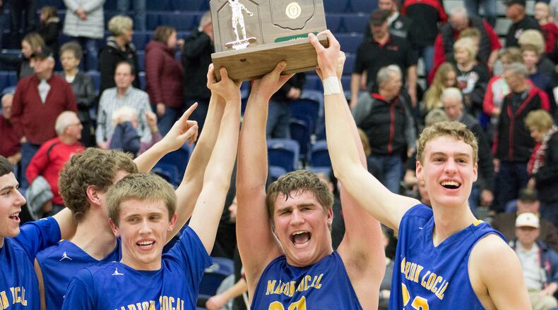 The Flyers celebrate a D-IV regional championship and trip to state final four. JEFF GILBERT / CONTRIBUTOR