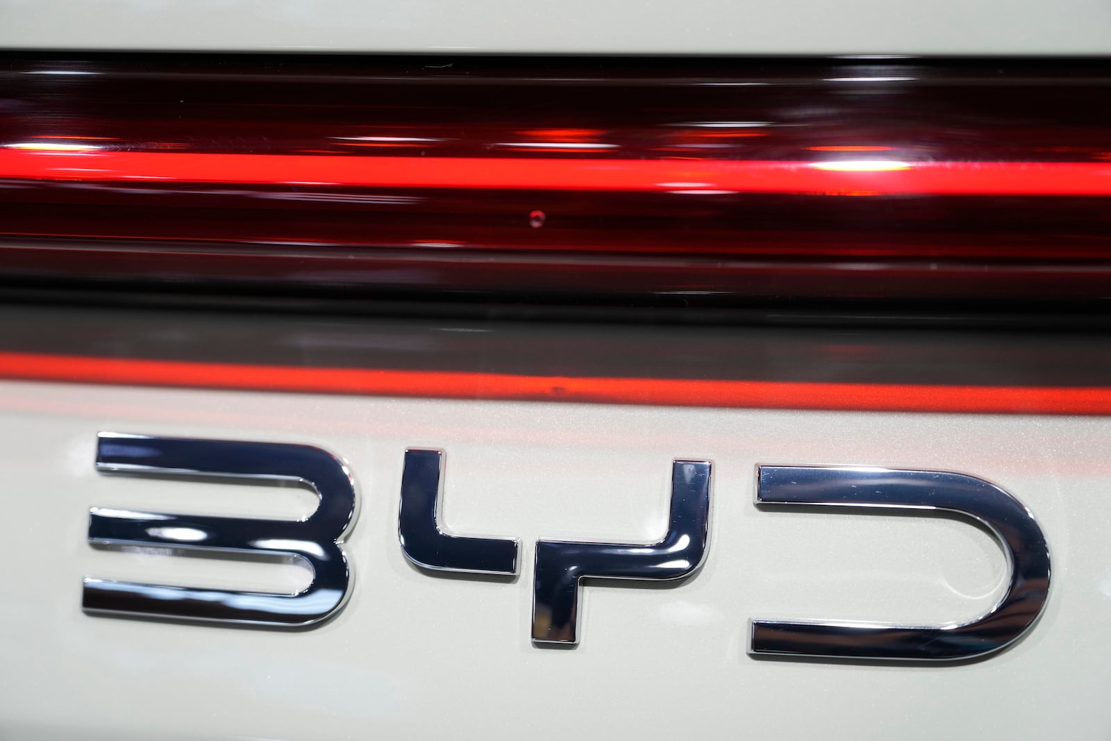 A BYD logo is seen during the Shanghai auto show on Wednesday, April 23, 2025. (AP Photo/Ng Han Guan)
