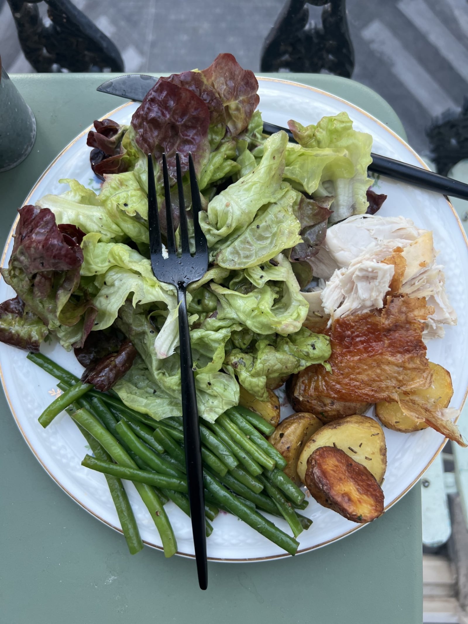 On a balcony in Paris/Montmartre, Whitney Kling enjoys a homemade meal of greens, chicken and potatoes. WHITNEY KLING/CONTRIBUTED