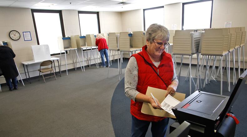 Deb Allender puts her ballot in the voting machine during the first day of early voting at the Clark County Board of Elections on Wednesday, Feb. 21, 2024. Early in-person voting looks a little different at the Board of Elections. Voter check-in will take place in the lobby when people walk in the building to allow more room in the in-person Voting Room. BILL LACKEY/STAFF