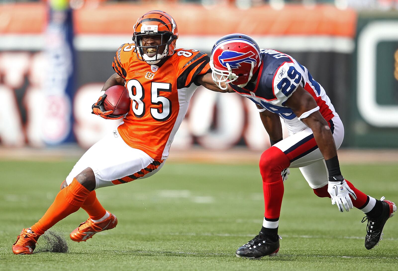 CINCINNATI - NOVEMBER 21: Chad Johnson #85 of the Cincinnati Bengals runs with the ball while defended by Drayton Florence #29 of the Buffalo Bills during the NFL game at Paul Brown Stadium on November 21, 2010 in Cincinnati, Ohio. The Bills won 49-31. (Photo by Andy Lyons/Getty Images)