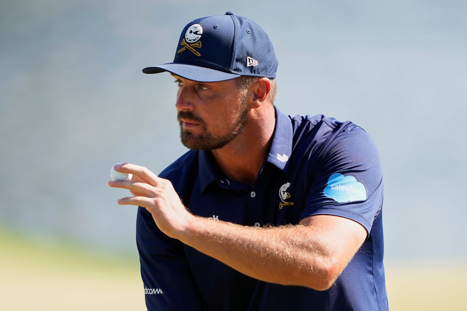 Bryson DeChambeau waves after making a putt on the 14th hole during the final round of the PGA Championship golf tournament at the Quail Hollow Club, Sunday, May 18, 2025, in Charlotte, N.C. (AP Photo/Matt York)