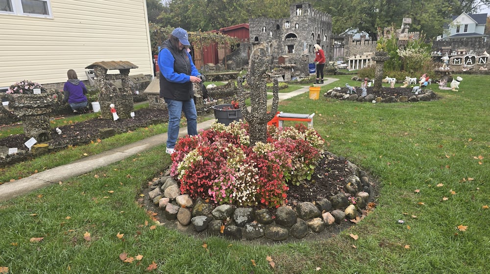 Volunteers at the Hartman Rock Garden in Springfield prepare the flower beds for winter. This gives them a head start on spring. CONTRIBUTED