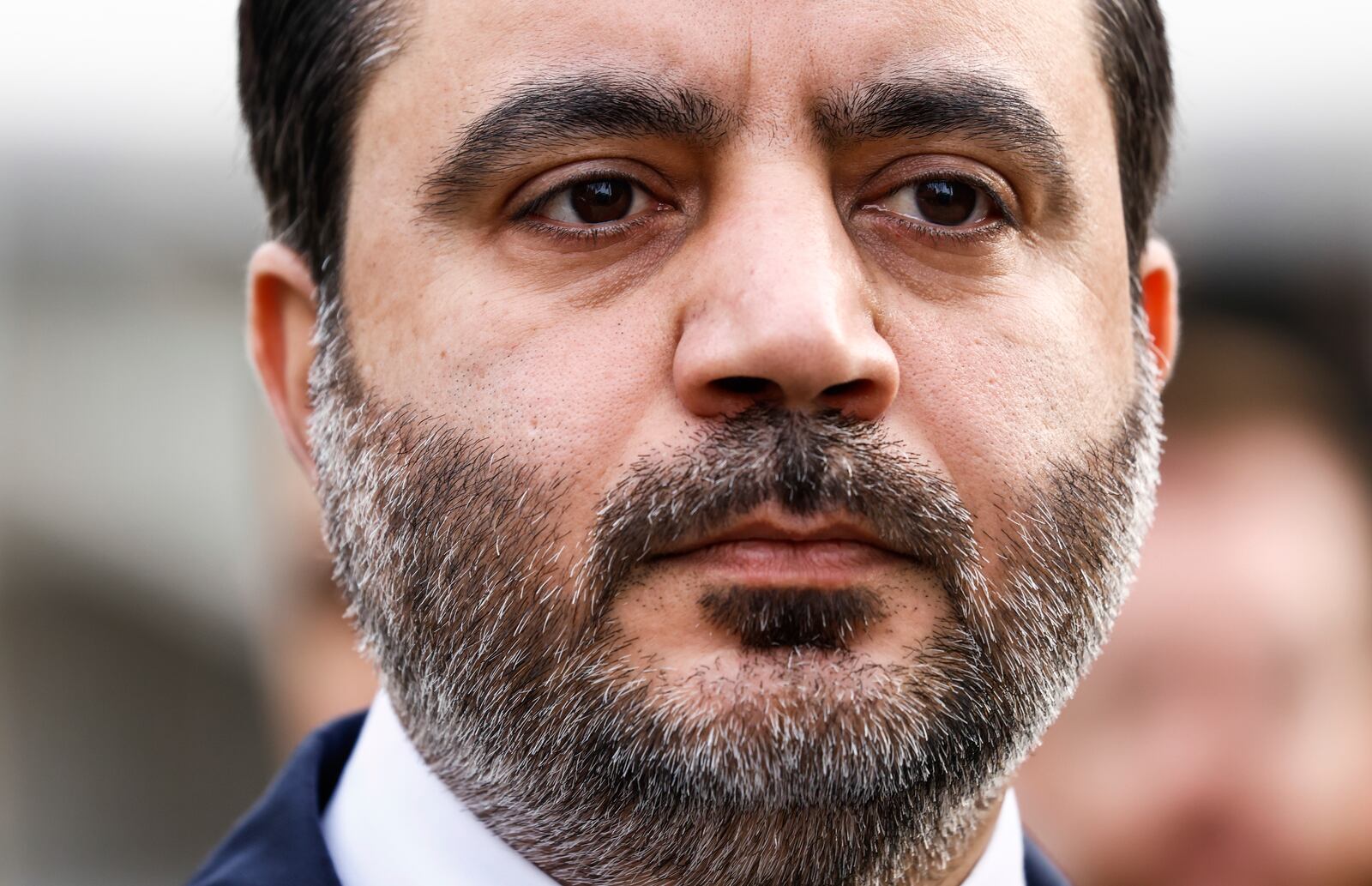 Syria's Foreign Minister Asaad Al-Shibani attends a ceremony where the Syrian flag was added to the 100 flags flying in line at United Nations Headquarters on Friday, April 25, 2025. (AP Photo/Kena Betancur)