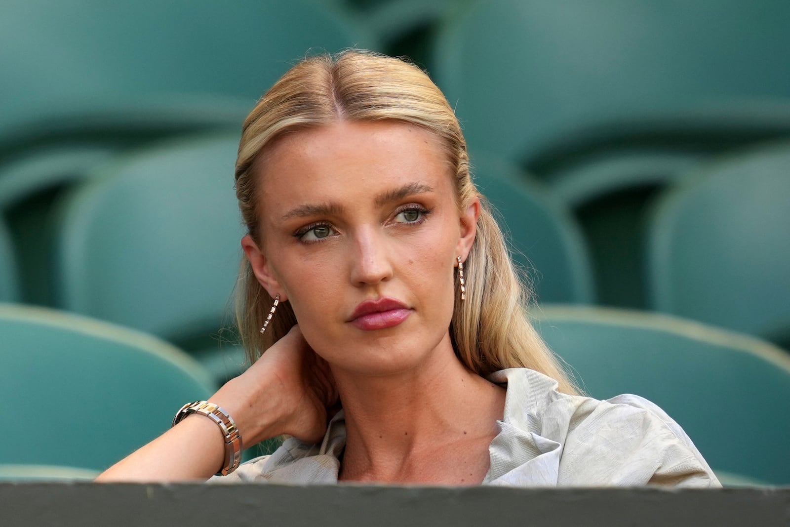 Morgan Riddle the girlfriend of Taylor Fritz of the U.S. takes her seat before her boyfriend plays Spain's Carlos Alcaraz in a men's singles semifinal at the Wimbledon Tennis Championships in London, Friday, July 11, 2025. (AP Photo/Kin Cheung)