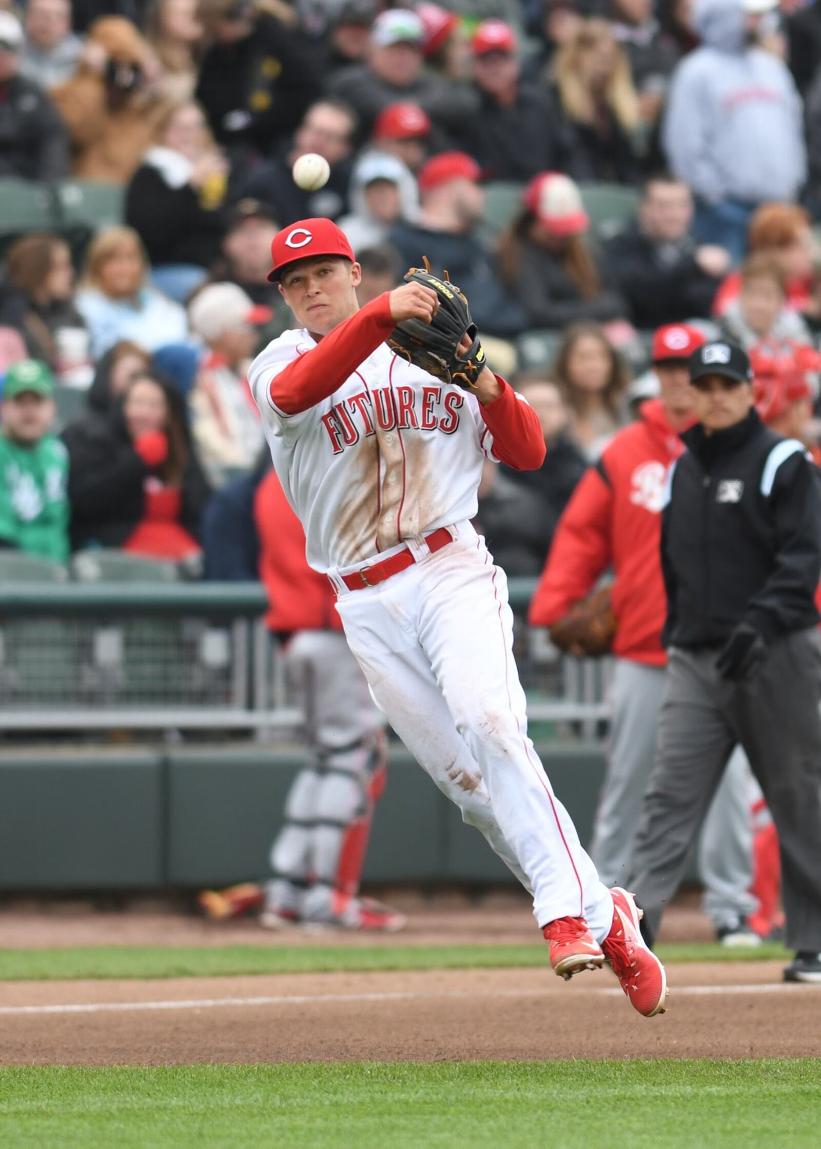 Nick Senzel makes a play at third base during the Reds Futures game at Fifth Third Field on Saturday, April 1, 2017. Senzel, the top prospect in the Reds farm system and the No. 2 prospect in all of minor league baseball, played third base for the Futures squad.