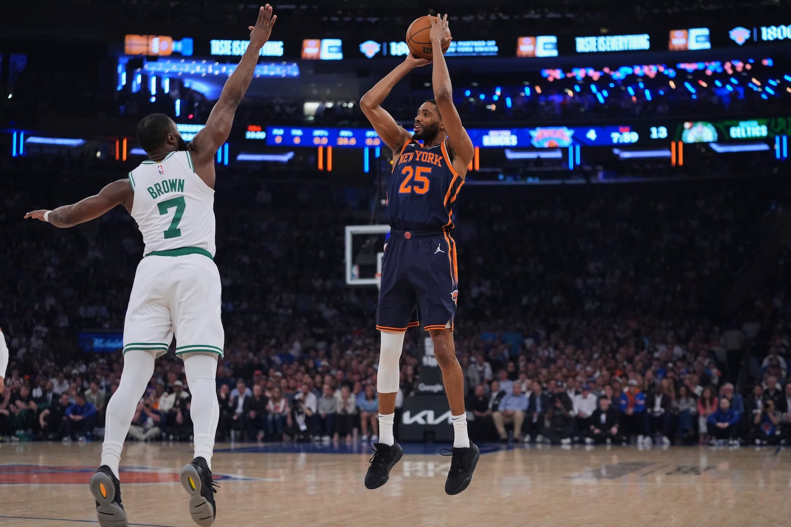 New York Knicks' Mikal Bridges (25) shoots over Boston Celtics' Jaylen Brown (7) during the first half of Game 4 in the Eastern Conference semifinals of the NBA basketball playoffs Monday, May 12, 2025, in New York. (AP Photo/Frank Franklin II)