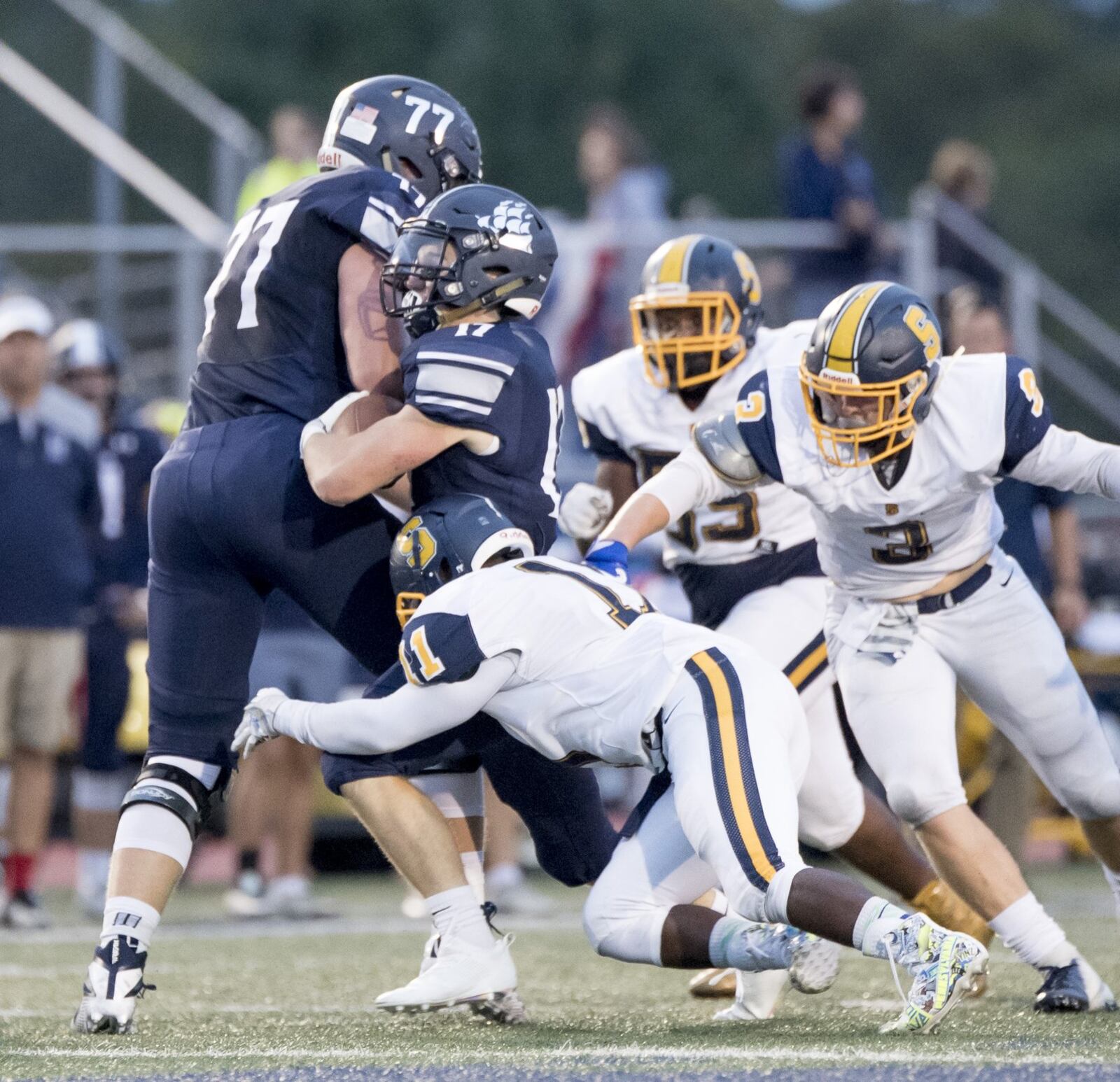Springfield junior Xzerious Stinnett (11) and senior Zack Breslin (3). Springfield defeated host Hudson 16-10 in a Week 3 high school football game on Friday, Sept. 7, 2018. K.M. KLEMENCIC / CONTRIBUTED